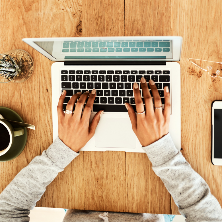 A person typing on a laptop