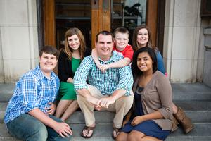 a family sitting on steps