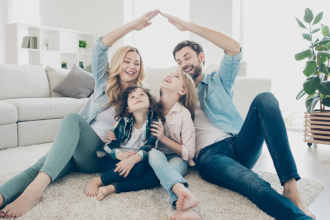 a family sitting on the living room floor