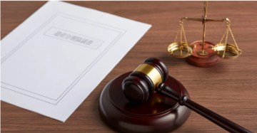 judges gavel, scale, and paperwork